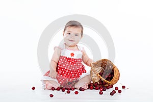 Little girl with a basket of cherries berries