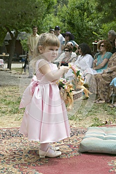 Little girl with basket of flowers at a traditional Jewish wedding in Ojai, CA