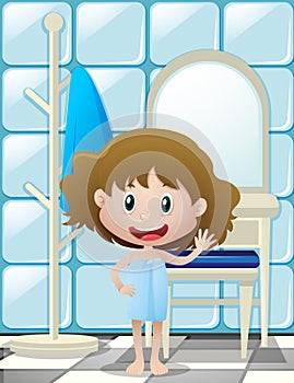 Little girl in bathtowel waving hand