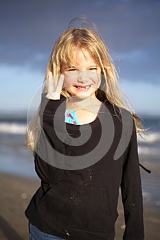 Little girl on beach at sunset