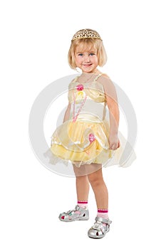 Little girl in a beautiful yellow dress and crown on white back