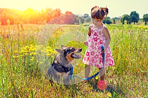 Little girl with big dog