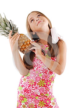 Little girl with big pineapple