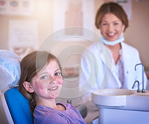 Little girl, big smile. a little girl at the dentist for a checkup.