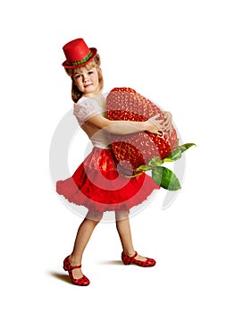 Little girl with a big strawberry