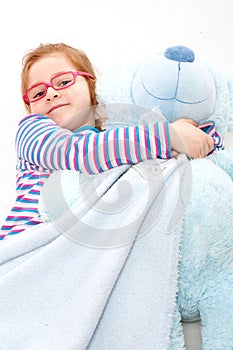 Little girl with big teddy bear