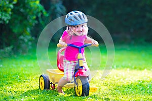 Little girl on a bike