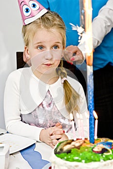 Little girl with birthday cake.