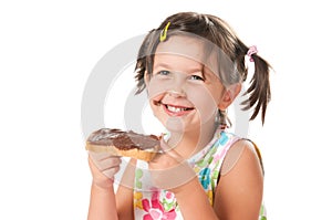 Little girl biting a snack