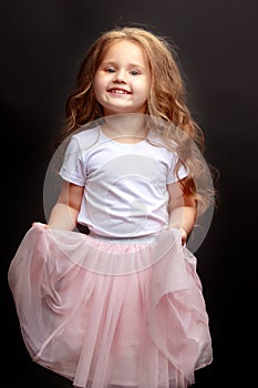 Little girl on a black background