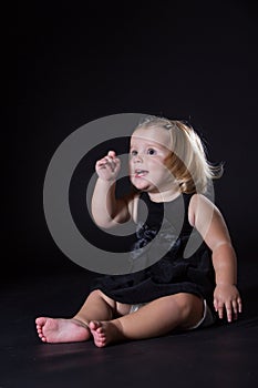 Little girl with a black background