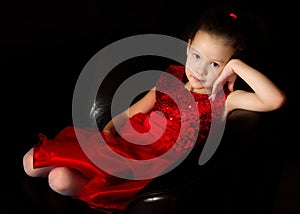 Little girl on a black background