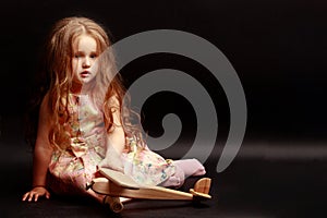 Little girl on a black background