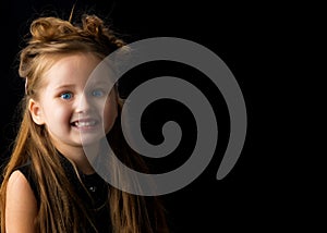 Little girl on a black background