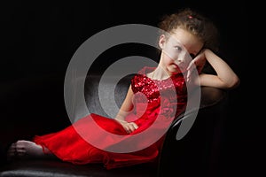 Little girl on a black background