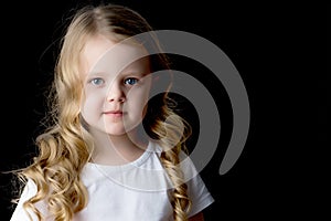 Little girl on a black background