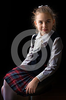 Little girl on a black background