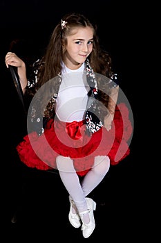 Little girl on a black background