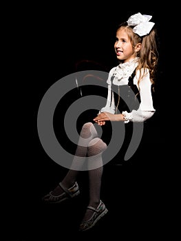 Little girl on a black background