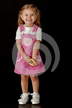 Little girl on a black background