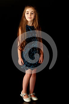 Little girl on a black background