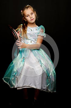 Little girl on a black background