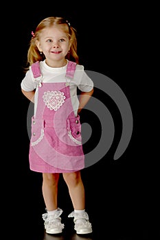 Little girl on a black background