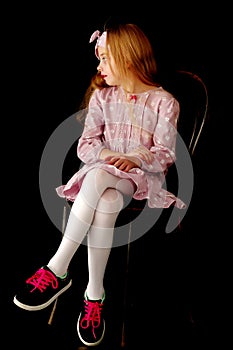 Little girl on a black background