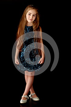 Little girl on a black background