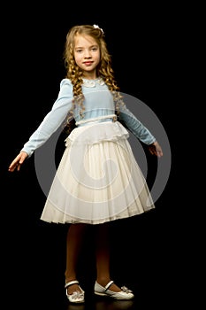 Little girl on a black background