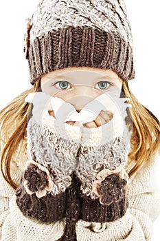 Little girl blowing her nose. Winter style.