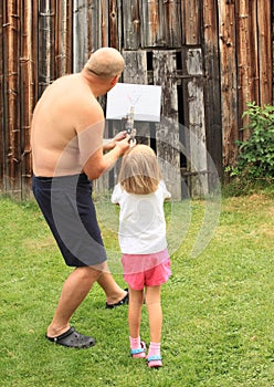 Little girl with blowpipe