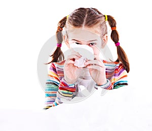 Little girl blows her nose