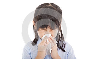 Little girl blows her nose