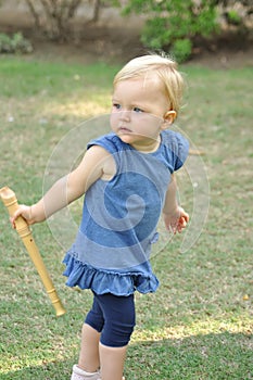 Little girl in blue dress in park