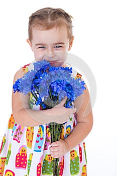 Little girl with blue flowers