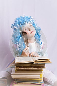 Little girl with blue hair writing a book