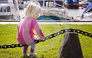 Little girl in boat marina