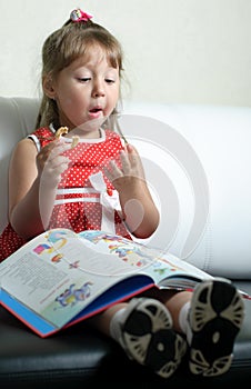 A little girl with a book