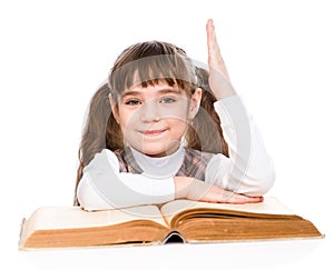 Little girl with book raising hand knowing the answer to the question. on white background