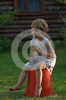 Little girl with a bottle