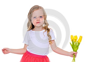 Little girl with a bouquet of tulips.