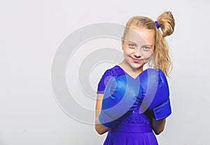 Little girl in boxing gloves punching. knockout and energy. Sport success. training with coach. Fight. Boxer child