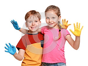 Little girl and boy with hands painted in Ukrainian flag colors on white background. Love Ukraine concept