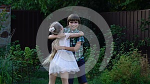 Little girl and boy hugging looking each other childrens emotions and friendship
