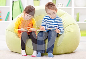 Little girl and boy reading