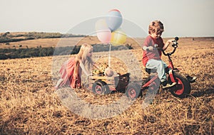 Little girl and boy smiling. Beautiful fun day for cute friends in nature. Happy moments. Happy. Happy little kids