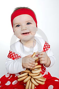 Little girl with bread-rings