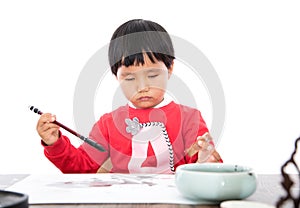 The little girl with brush in right hand and seal in left hand in white background