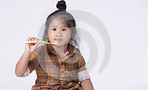 Little girl brushing her teeth